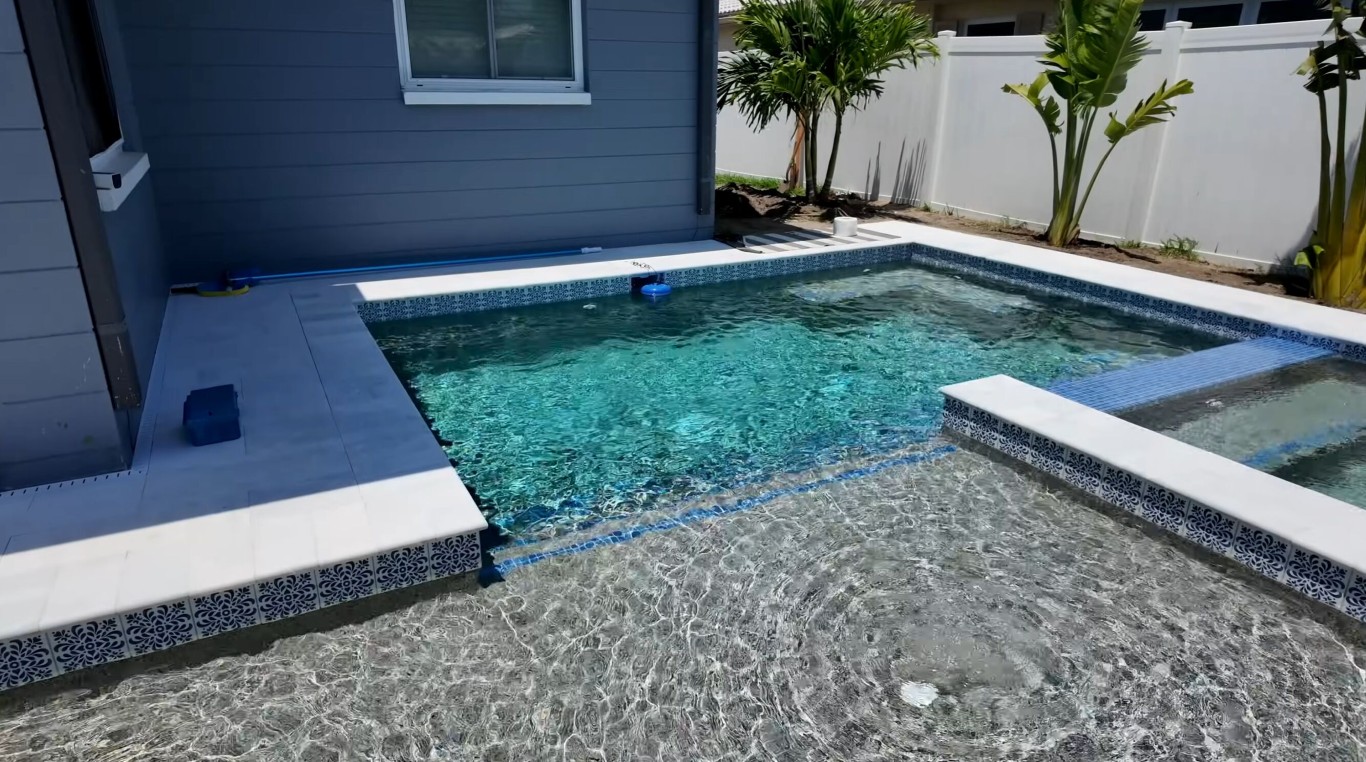 Crystal clear pool water after professional cleaning in Wellington, FL